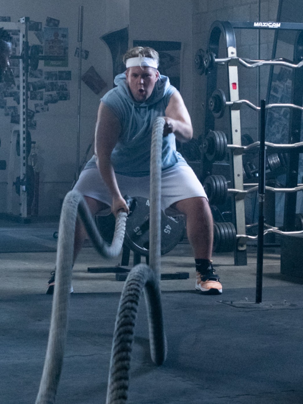 Man wearing an Oura Ring doing cross fit exercise with ropes