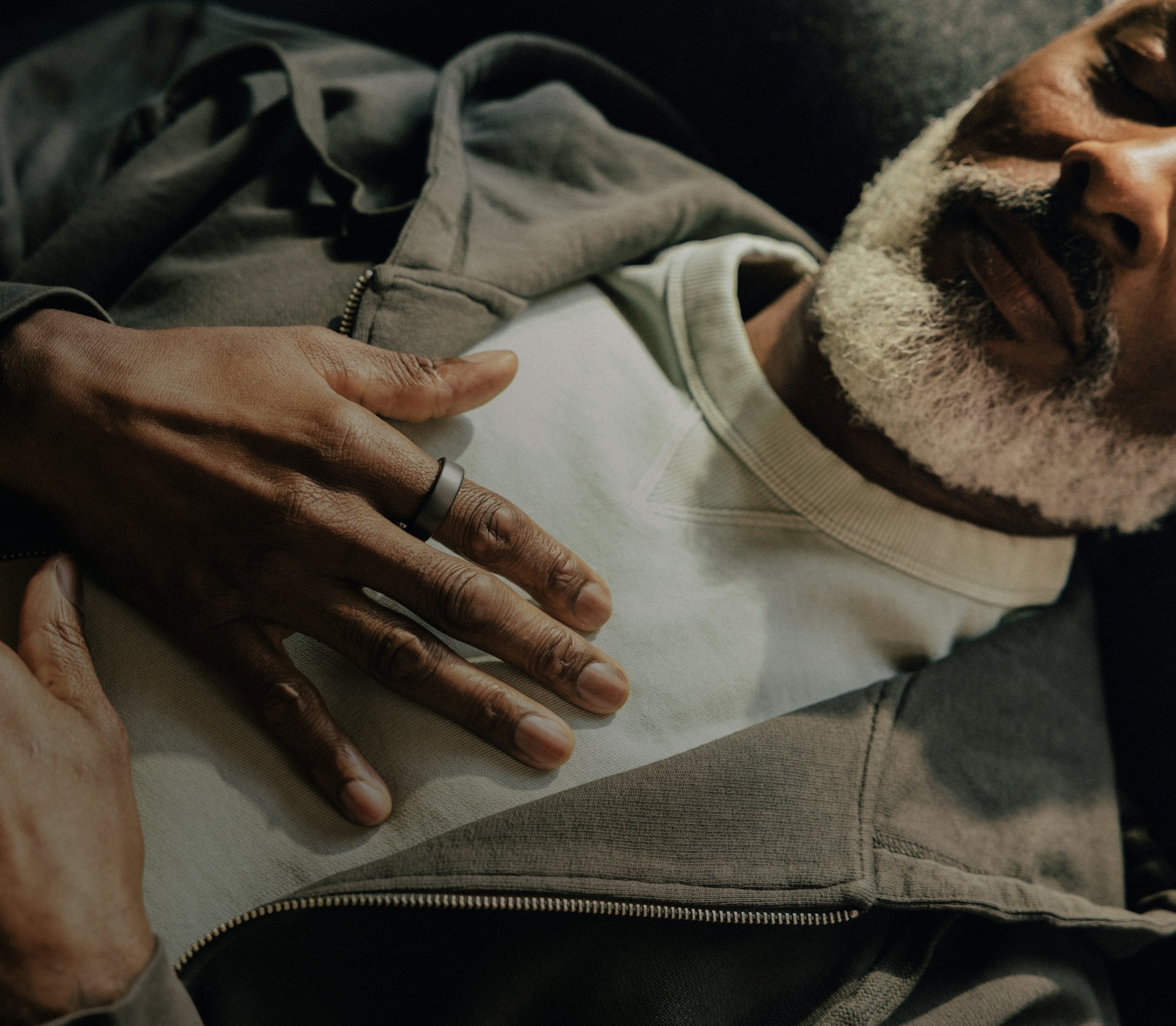 Hand wearing Oura ring holding a fork with spaghetti