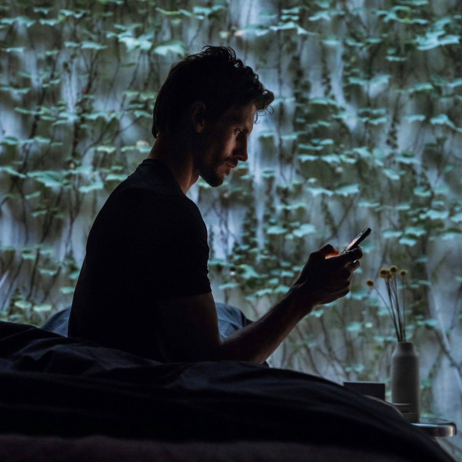 Man checking Oura app at start of his day